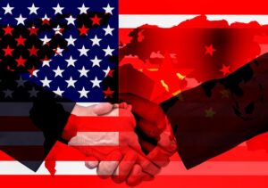 President Donald Trump shaking hands with Chinese officials amid trade talks during Asia diplomacy tour