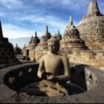 Borobudur Temple perforated stupas with Buddha statues at sunrise, Yogyakarta Travel Guide 2026