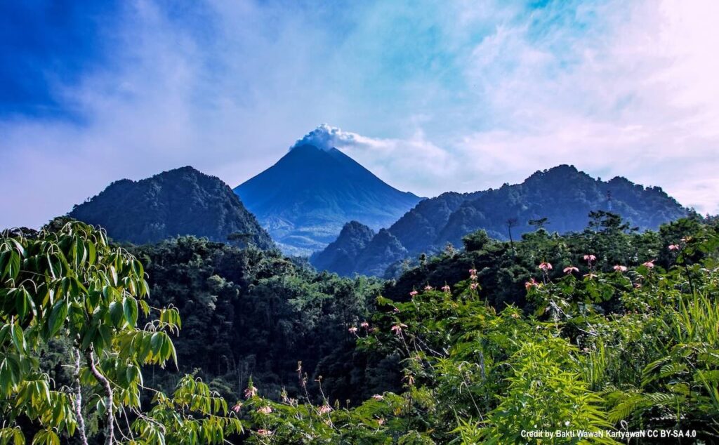 Mount Merapi with fumes from distance Yogyakarta Travel Guide