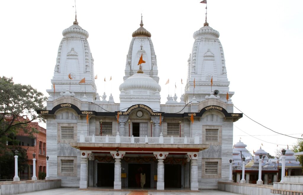 Front view of the main temple building of Baba Gorakhnath Temple showing its grand white architecture and prominent temple entrance.