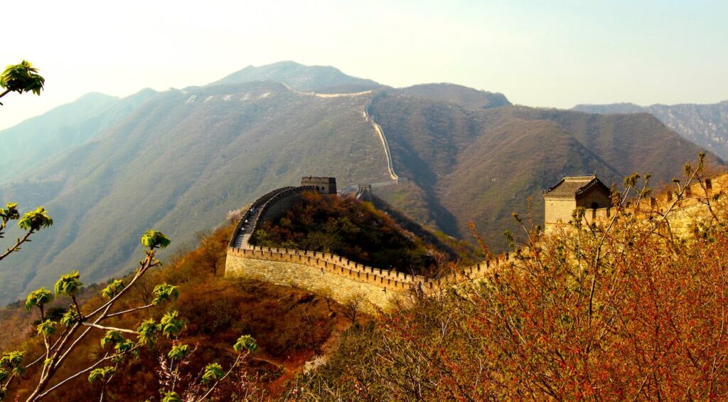 The Great Wall of China at Mutianyu with stunning mountain scenery and cherry blossoms