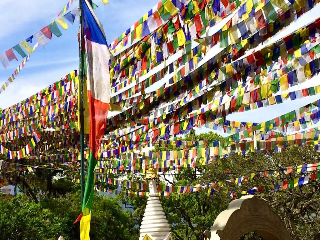 Swayambhunath Stupa approach from lower level with colourful prayer flags, Kathmandu