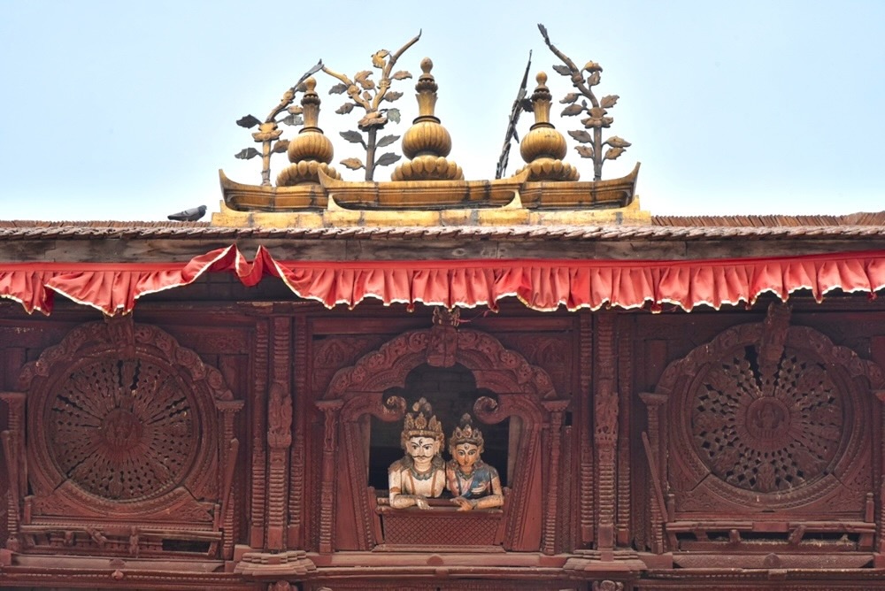 Famous carved window with Shiva and Parvati looking out from Shiva-Parvati Temple, Kathmandu Durbar Square