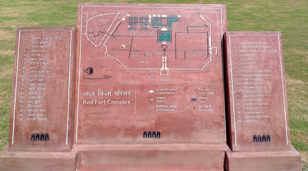 Lal Qila map with 20 buildings names engraved on red stone signboard during Delhi Heritage Walk