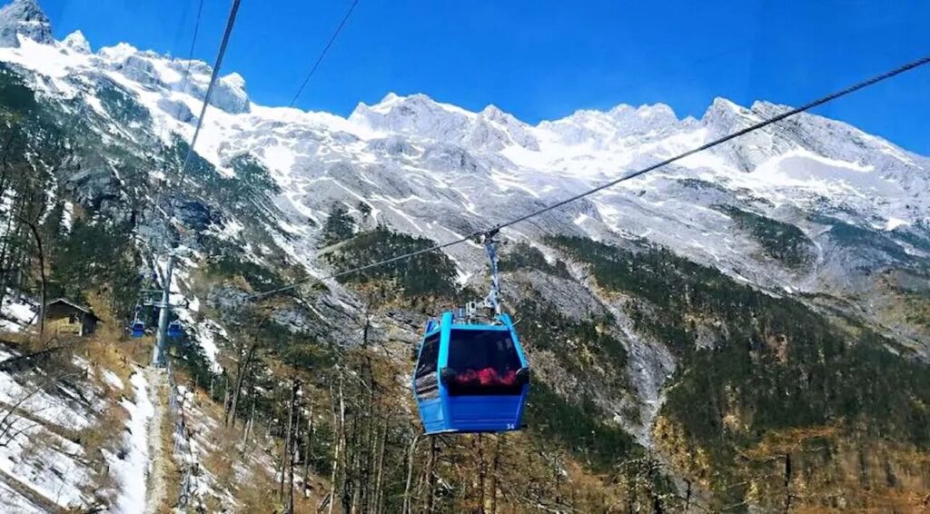 Jade Dragon Snow Mountain Ropeway with snow-capped peaks in Yunnan, China.