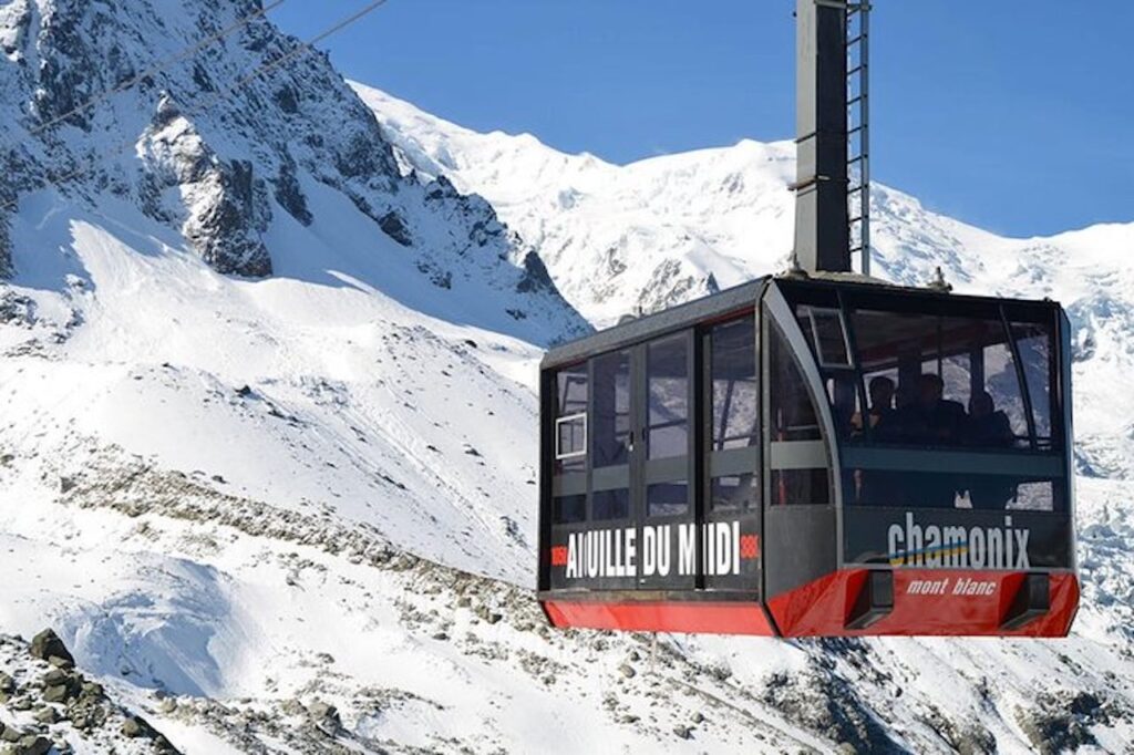 Aiguille du Midi cable car ascending above Chamonix in the French Alps